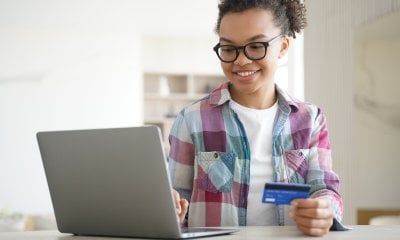 /thumbs/400×240×85×c/entries/mixed-race-teen-girl-holds-bank-credit-card-uses-o-2023-11-27-04-57-17-utc.jpg